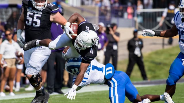 Sep 10, 2022; Evanston, Illinois, USA; Duke Blue Devils defensive back Darius Joiner (1) tackles Northwestern Wildcats running back Cam Porter (4) during the first quarter at Ryan Field. Mandatory Credit: Patrick Gorski-USA TODAY Sports